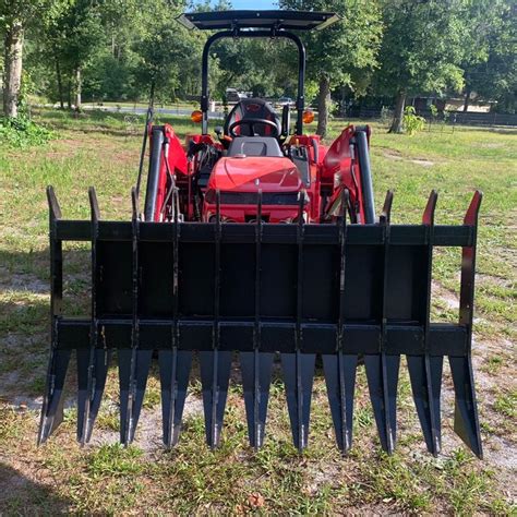 clearing brush with skid steer bucket|skid steer debris blower attachment.